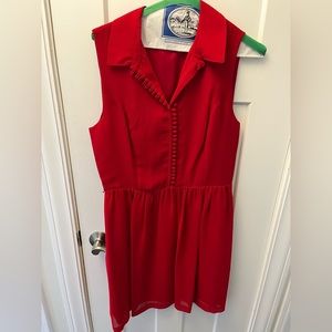 Red dress with sheer cloth belt.